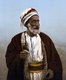 Palestine: A Palestinian patriarch and village chief. Hand colored photographic print, early 20th century